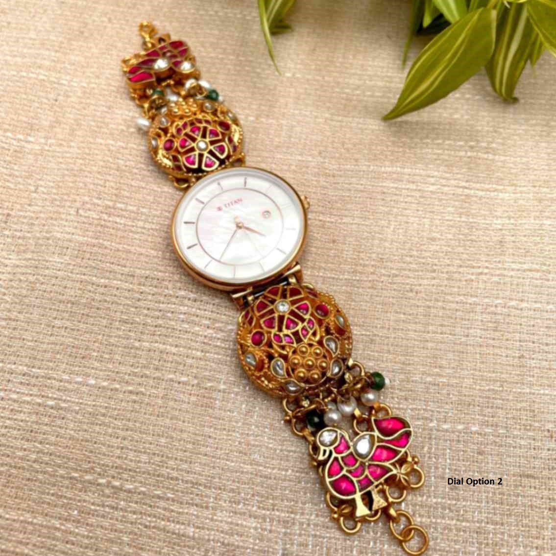 Silver Watch with beautifully carved kundan set floral and peacock motifs and some stones and pearls. The dial is of Original TITAN company, comes with a warranty card. Length of the watch is custom made according to the wrist size. Silver Watch with beautifully carved kundan set floral and peacock motifs and some stones and pearls. The dial is of Original TITAN company, comes with a warranty card. Length of the watch is custom made according to the wrist size.